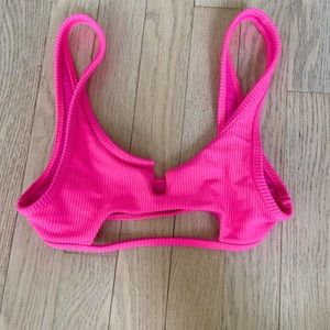 Frankie’s bright pink bikini top